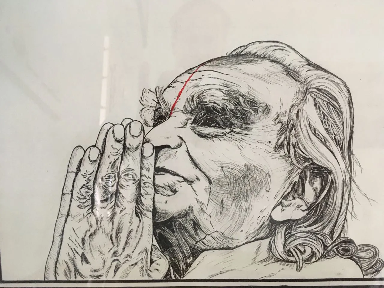 A pen drawing of Guruji in profile, his palms pressed together in namaskar, with a red line for the tilak
